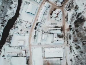 Aerial view of snow-covered buildings and landscapes in Corner Brook, NL, Canada.